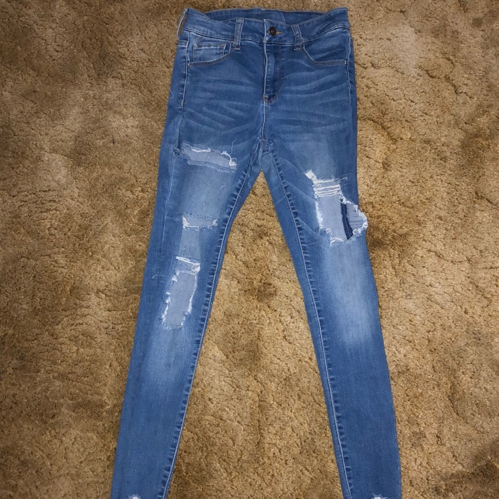 fairly worn ripped jeans